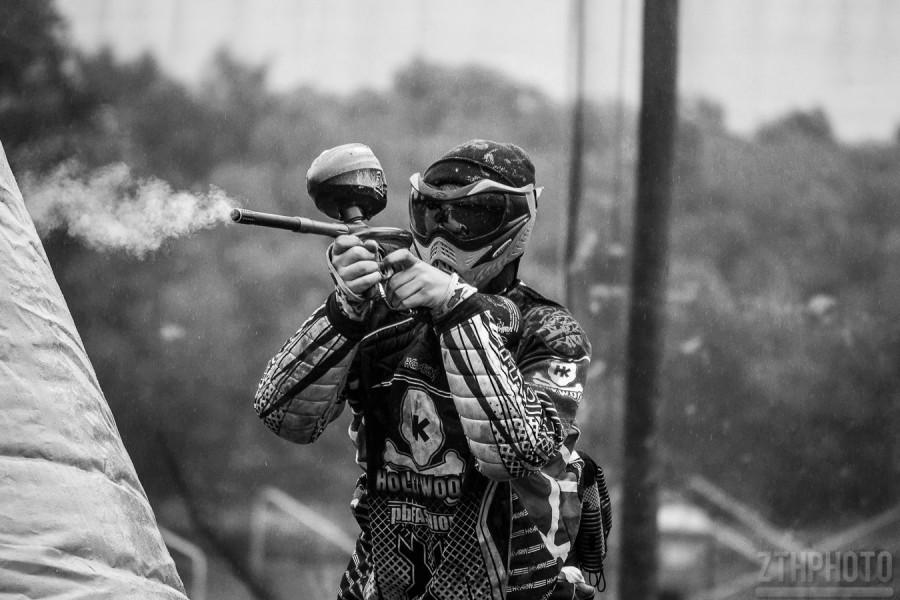 Players in paintball gear up in long sleeved shirts and long pants to protect their skin from the paintballs whizzing at them. They also wear pads at the competitive level because they slide on the ground often. 