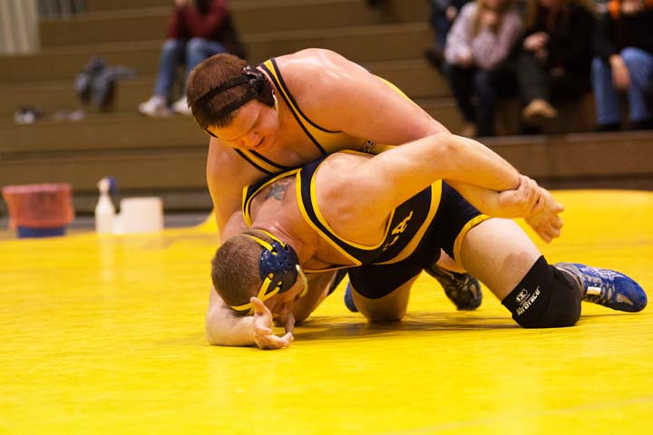 Wilkes Colonel William Fletcher (left) battles Ithaca’s Shane Bartrum in the 285-weight class. Fletcher won the match in overtime.