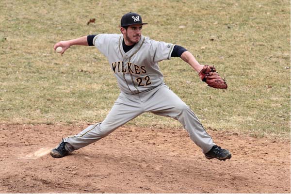 Sophomore pitcher Tom Ring stretches out from the mound.