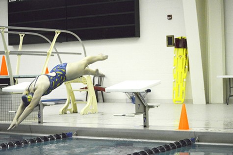 A member of the Wilkes swim team perfects her start in preparation for meets.