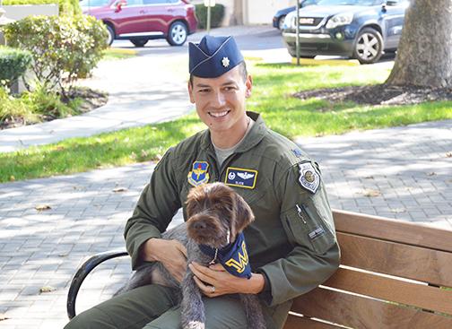 Libby, the psychological service dog, and Lt. Col. John Baum.