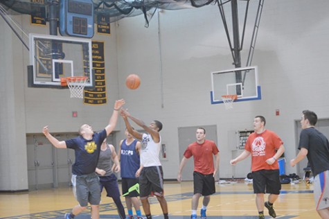 Members of the men’s basketball team compete hard for a rebound at a recent practice for their upcoming season right. 