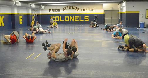 Wrestlers practice their top and bottom techniques during an off-season practice this past week.