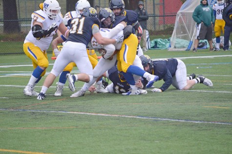 Junior Tanner Tengel makes a tackle during homecoming game against Widener.