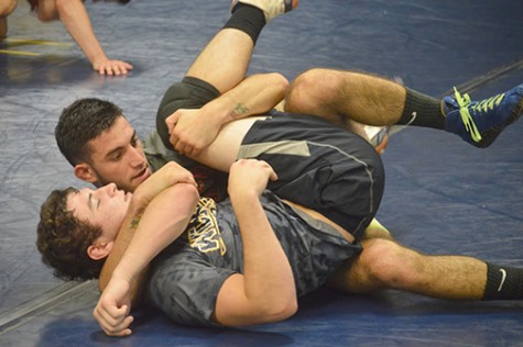 Ashton Gyenicz is getting cradled by Jake Dimarsico at last week’s practice.