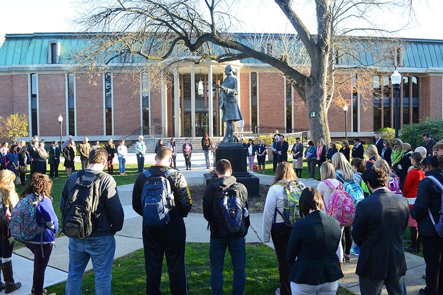 Members of the university gather for a moment of silence in honor of the victims of the Paris attacks. 