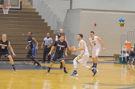 Freshman guard Clay Basalyga gets ready to set up a teammate at this past Tuesday night’s game.