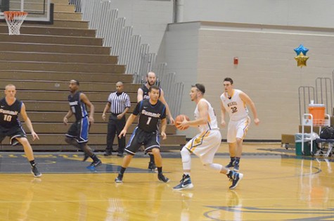 Freshman guard Clay Basalyga gets ready to set up  a teammate at this past Tuesday night’s game.