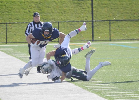 Wide receiver Aaron Coyne catches the ball on the sideline against Stevenson this past Saturday.