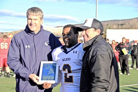 Powell alongside President Leahy and head coach Trey Brown accepting the MVP award after the victorious win against King’s this past Saturday.