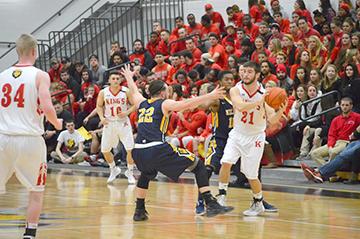 Freshman guard Clay Basalyga locking up against King’s disrupting their offense.