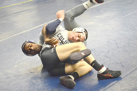 Michael Fleck practices a takedown with Pankil Chander at a recent practice this past week.