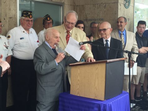 Albert Boscov pretends to eat the plaque which he described as “tasty”