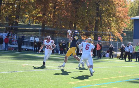 #87 Garrett Armstrong hauls in a Jose Tabora pass for a Colonel touchdown.