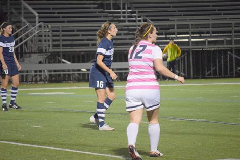 #18 junior defensive player Julia Tyler points out a player attacking.