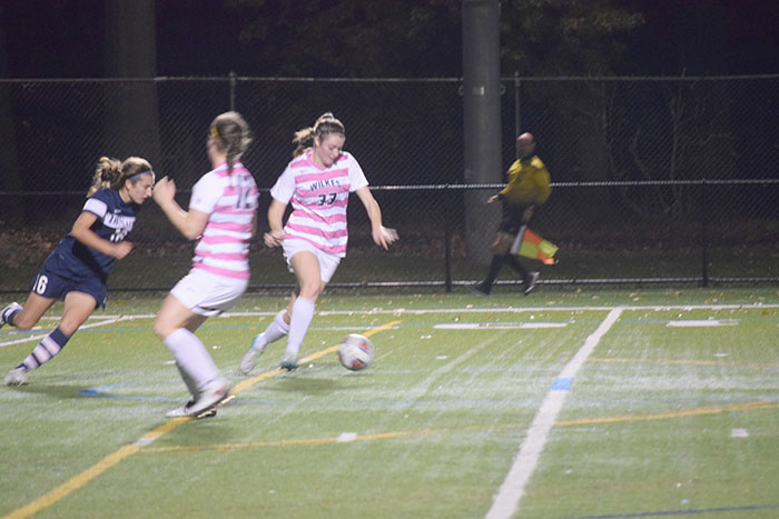 #22 Shelby Trumbo clears the ball upfield.