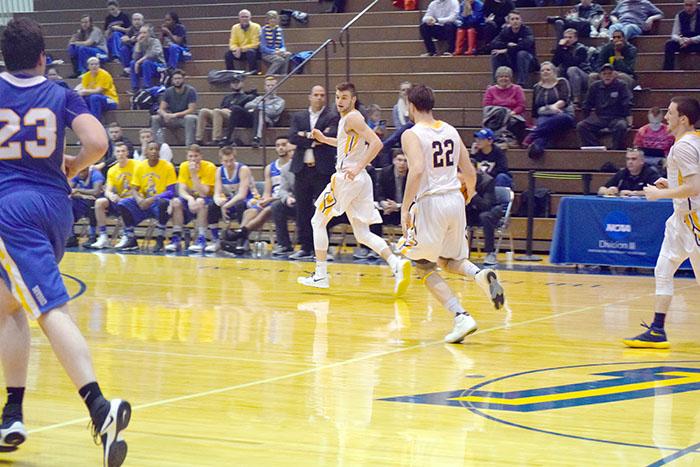 First-year player #12 Mark Mullins looks to receive a pass from #22 Clay Basalyga