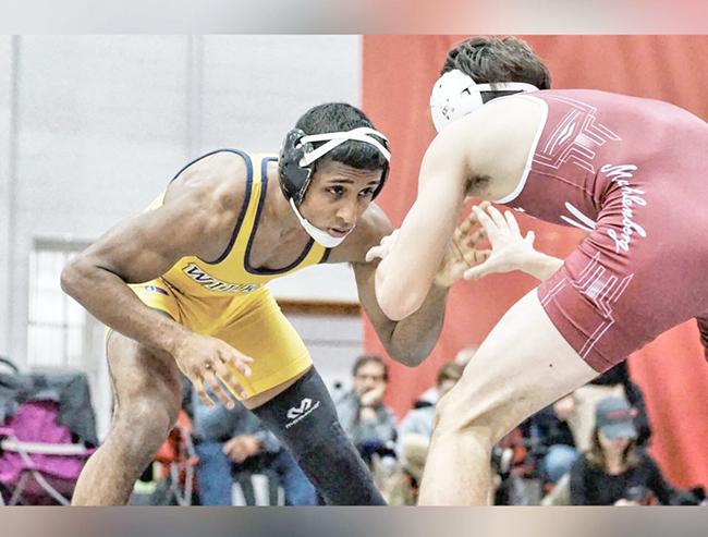 Chander+wrestles+an+opponent+from+a+recent+match.