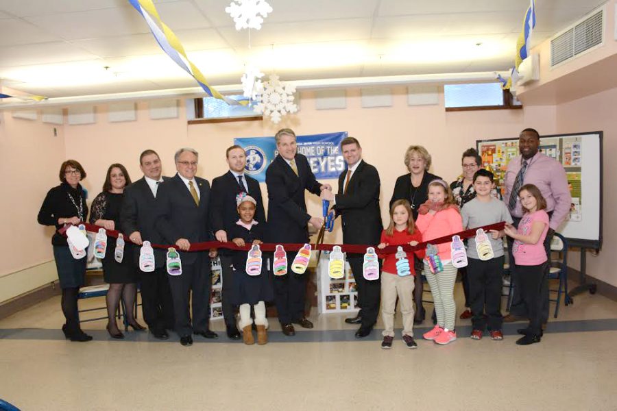 The SHINE program celebrated the grand opening of its eighth center at Lee Park Elementary School. Pictured is the ribbon cutting ceremony, with the ribbon adorned with images colored in by students.

Children, left to right: Reliant Hernandez De La Cruz; Faith Jones; Skyler Purta; Jaydon Skipalis; Jolene Booth.
Adults, left to right: Kellie Kuhl, SHINE lead teacher; Ann Marie Kochuba-Mantione, Lee Park Elementary School principal; Andrew Kuhl, Hanover Area superintendent; Representative Eddie Day Pashinski; Tyler Brezinsky, representing Congressman Lou Barletta; President Patrick Leahy, Wilkes University; Senator John Yudichak; Carol Nicholas, Luzerne County SHINE director; Deanna Drako, SHINE assistant director of middle school programs;  Marlon Pitts, SHINE assistant director of elementary programs.