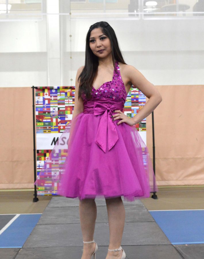 Nilo Mominzada, freshman, modeled two dresses at the fashion show. Pictured is the first.