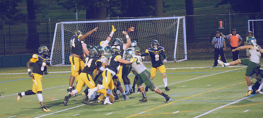 Ryan Bowman (#70) blocks the extra point of Delware Valley’s Pat Moran. 
