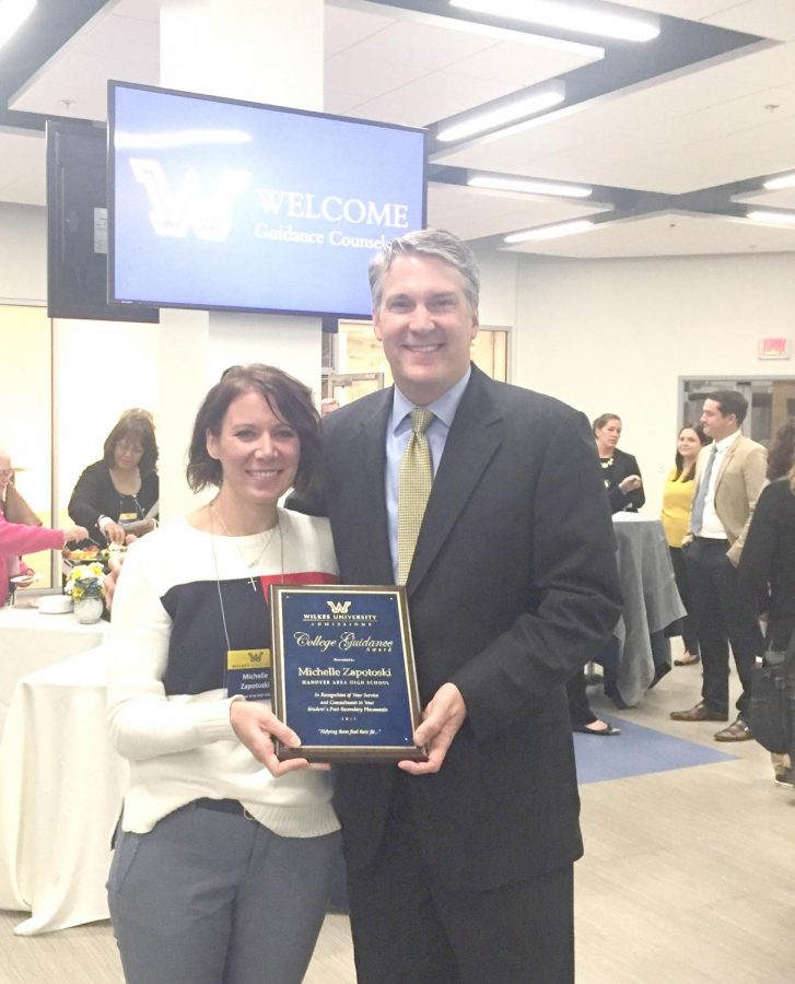 Michelle Zapotoski, a guidance counselor at Hanover Area Junior Senior High School, poses with Wilkes President Patrick Leahy after being named “Guidance Counselor of the Year.