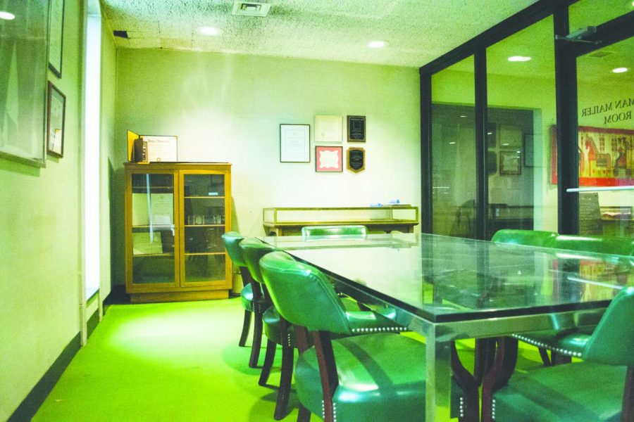 Norman Mailer’s own personal dining room table from his house in Provincetown, Mass., sits in the middle of the Normal Mailer room between his awards and first editions of his books.