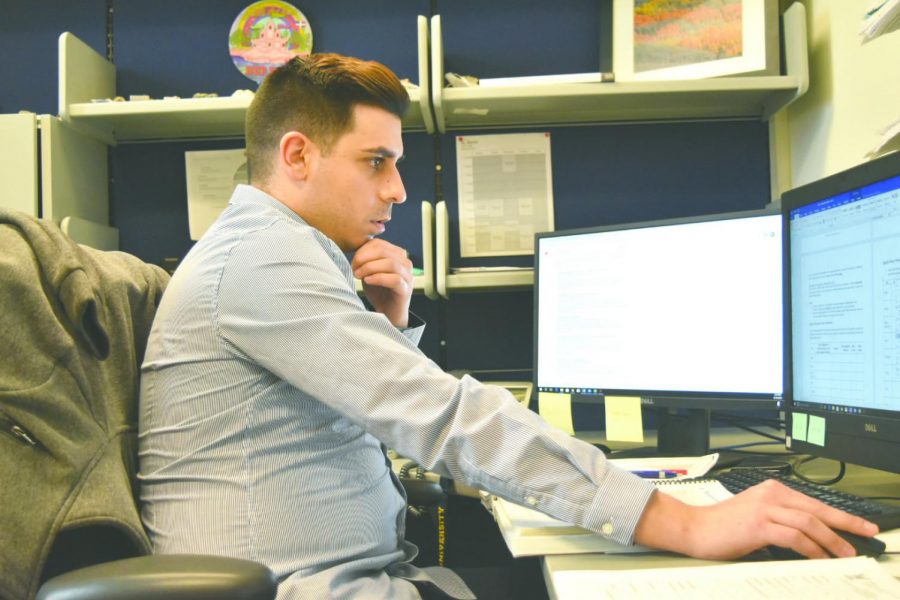 Dr. Bobby Karimi often sits at his office computer analyzing his recent research results.