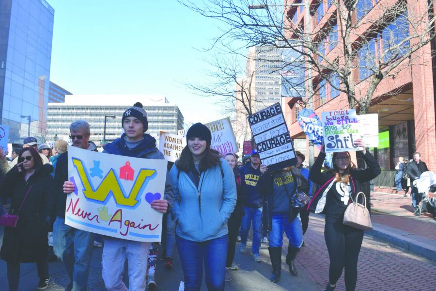 Gregory+Chang+and+Keira+Kuhar+lead+Wilkes+University+students+and+faculty+down+Market+Street+in+Philadelphia+during+the+March+for+Our+Lives+Protest+on+Mar.+24.