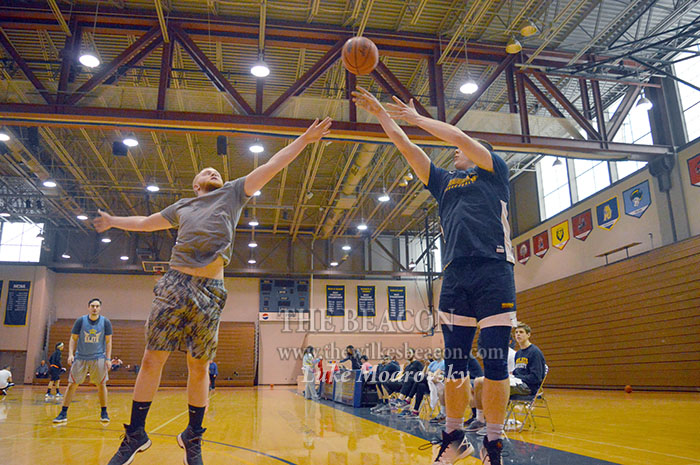 Mason Gross shoots over Angel Lopez during Sundays 3-on-3 basketball tournament hosted by Wilkes.