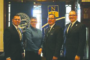 From left to right: Scott Stolte; Anne Skelder; Lawrence DiPaolo, vice president of Neumann University; Alfred Mueller, dean of arts and sciences at Neumann