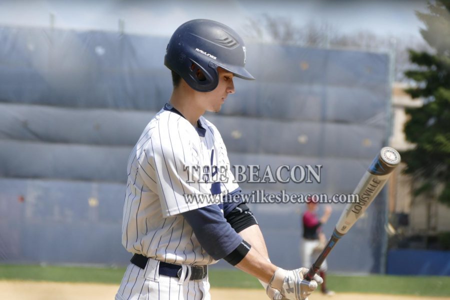 Sophomore Matt Reinert stepping into the batters box against Manhattanville