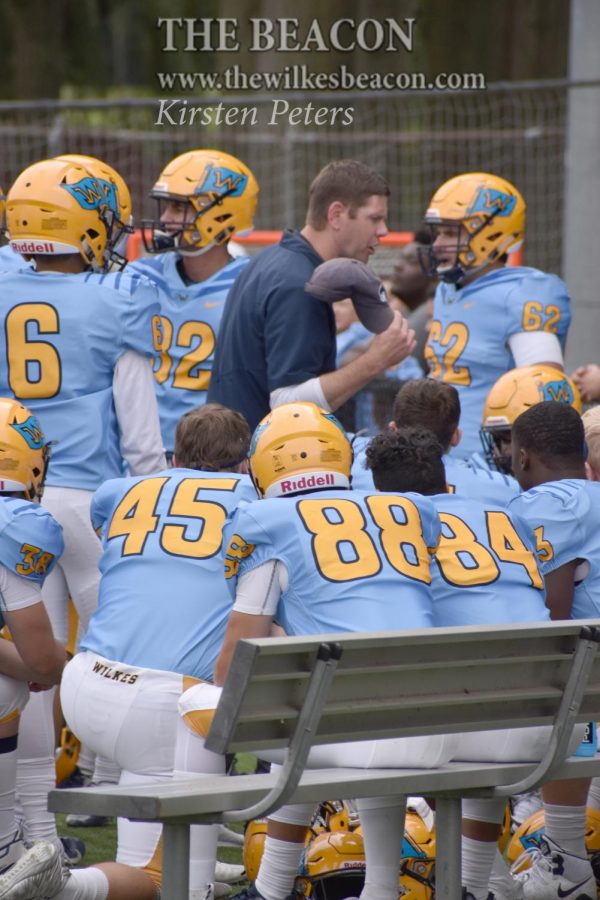 Coach Drach gives instruction on the sidelines after not executing a play against Misericordia. 