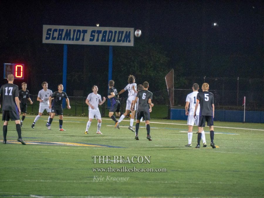 Senior Alvaro Fernandez-Maldonado heads a ball in an attempt to start another Colonel offensive attack.