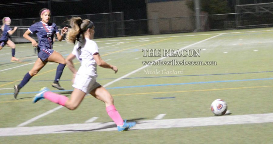 Senior Nicolette Towlen races down the sideline with the ball during the MAC Freedom semifinal game.