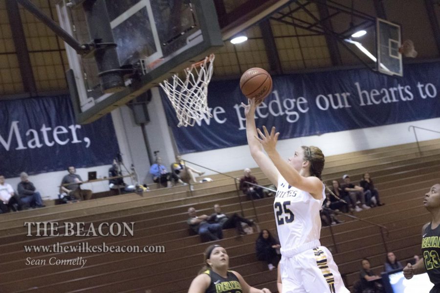 Senior forward Ashley Caster sinks a two-point shot and the and-one from the line after being fouled to stretch the Colonels lead to 24-12 in the second quarter. 