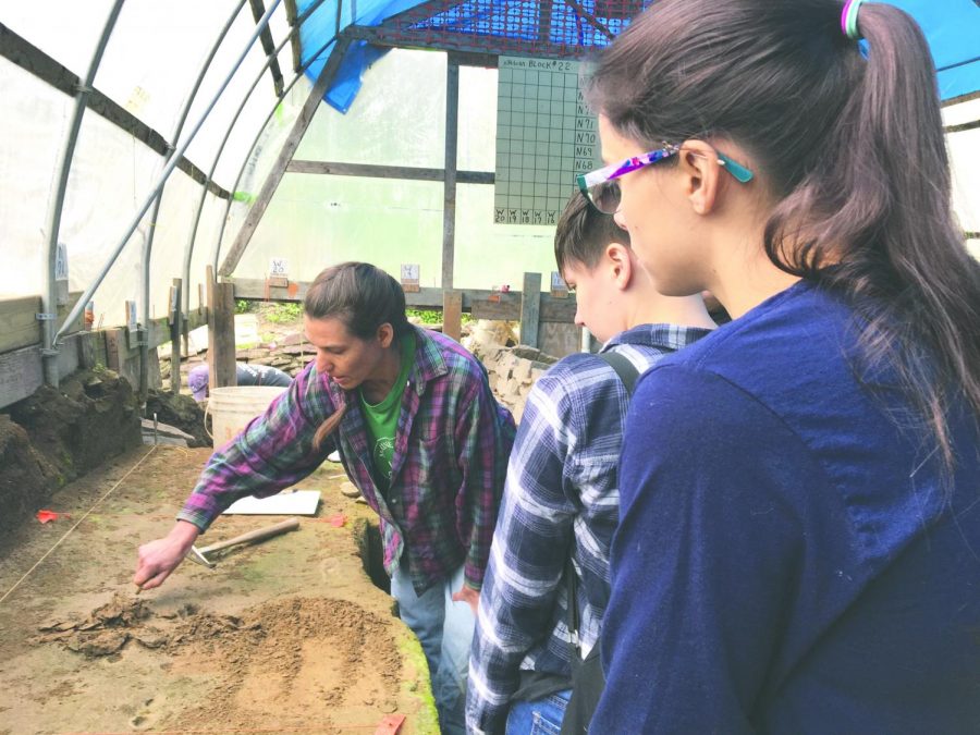 Eileen Blaine and Cece Hornbaker look to learn the methodology of excavation.