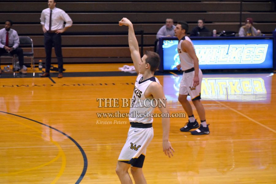 Junior Rob Pecorelli swishes a three-pointer against Manhattanville.