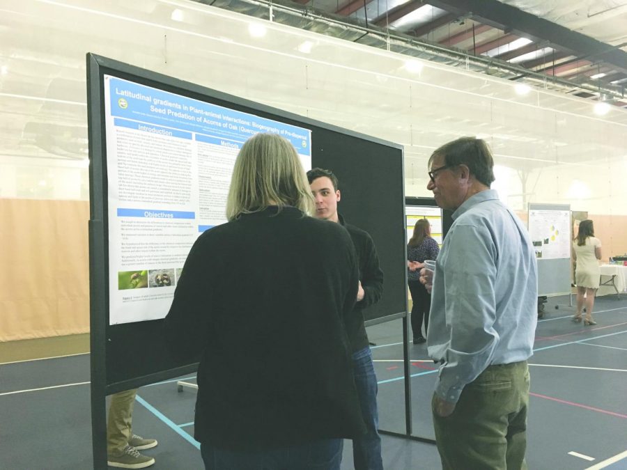 Senior biology major Brendon Kelly presents his research titled “Latitudinal gradients in plant-animal interactions: biogeography of pre-dispersal seed predation of acorns of oak  by insect  larvae.“