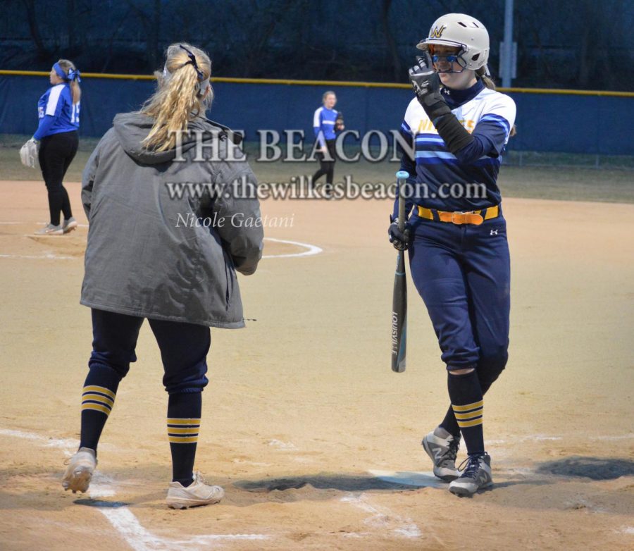 Senior+outfielder+Haley+Welker+signaled+to+her+teammates+with+a+smile+on+her+face+during+the+doubleheader+against+Clarks+Summit+last+Wednesday.