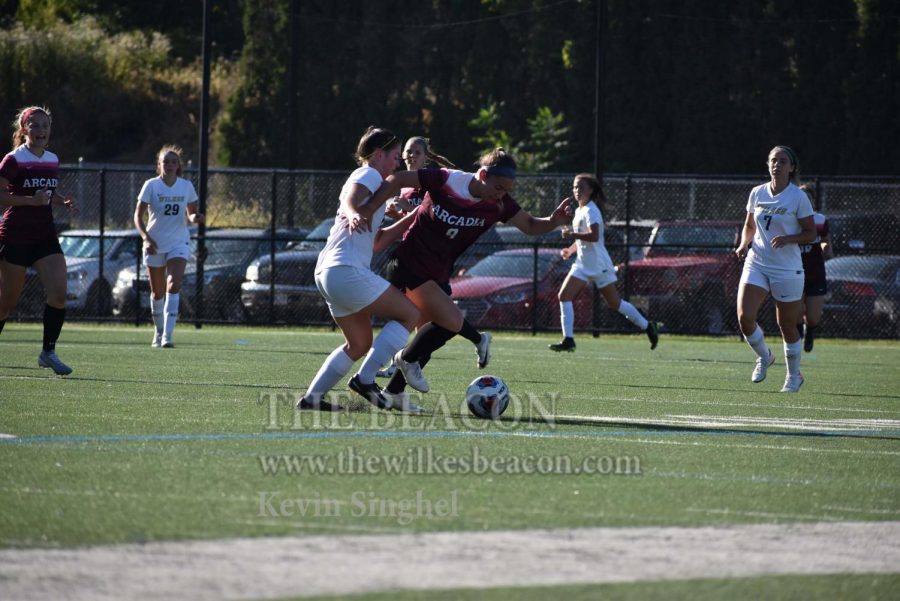 Junior defender Catherine Gregoire attempts to stop Arcadia’s push up the field in Saturday’s contest against the nationally-ranked opponent.
