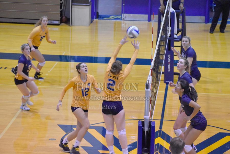 Sophomore setter Karlye Huffman prepares the ball for senior middle hitter Michele Natale in the third set against DeSales.