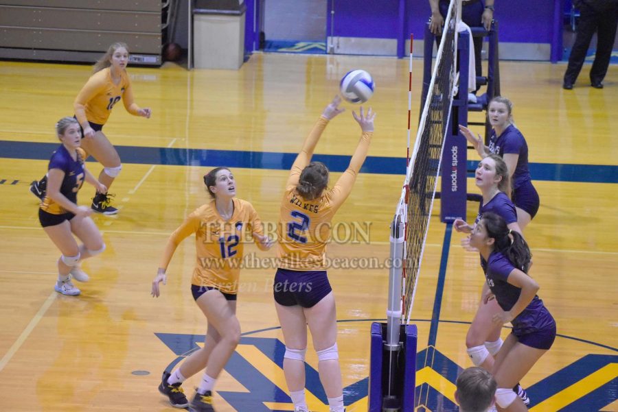 Sophomore setter Karlye Huffman prepares the ball for senior middle hitter Michele Natale in the third set against DeSales.