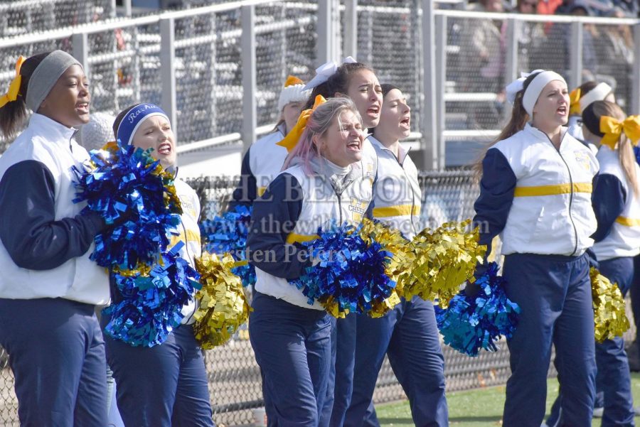 The Wilkes cheerleading team energizes the football team and fans during Wilkes’ game against Stevenson on Saturday.
