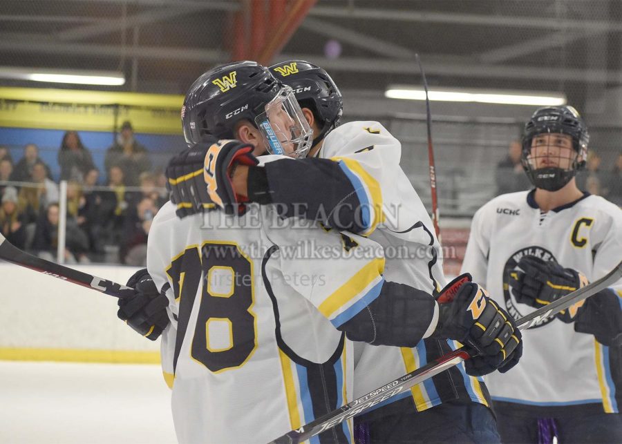 Xavier Abdella embraced Phil Erickson after the Colonels fourth goal of the second period against Kings, increasing Wilkes lead to three with a score of 5-2.
