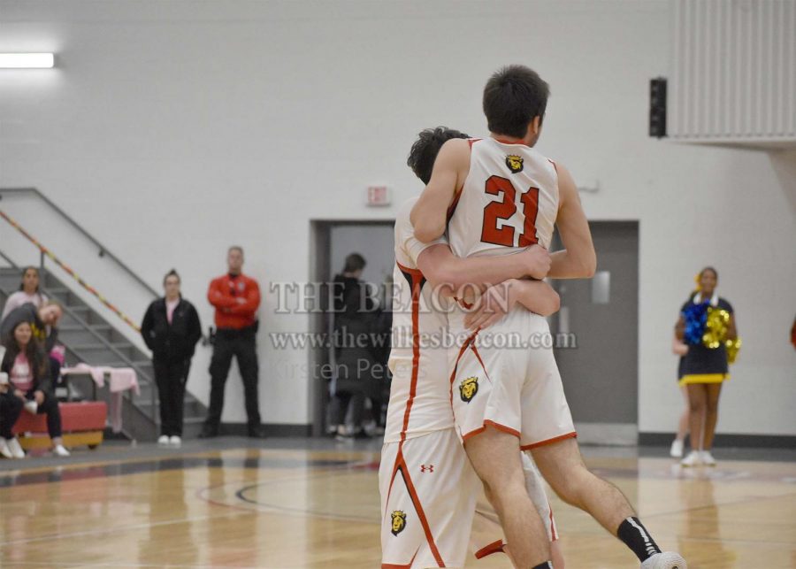 King’s Andrew Hudak embraced teammate Patrick Galvin (21) after Galvin makes the go-ahead foul-line jumper with 3.4 seconds remaining in the contest.
