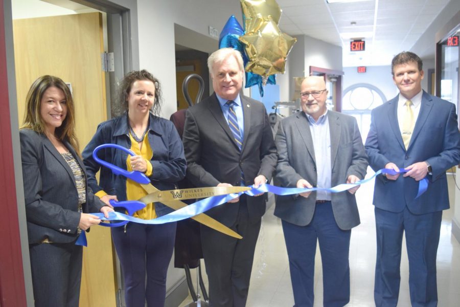 Sharon Castano, director of student development; Lisa Mulvey, coordinator for career development and internships; Interim President Dr. Paul Adams; Mark Allen, vice president of student affairs and Phil Ruthkowsky, associate dean of student development at the ribbon cutting ceremony for the Colonel Clothing Closet.