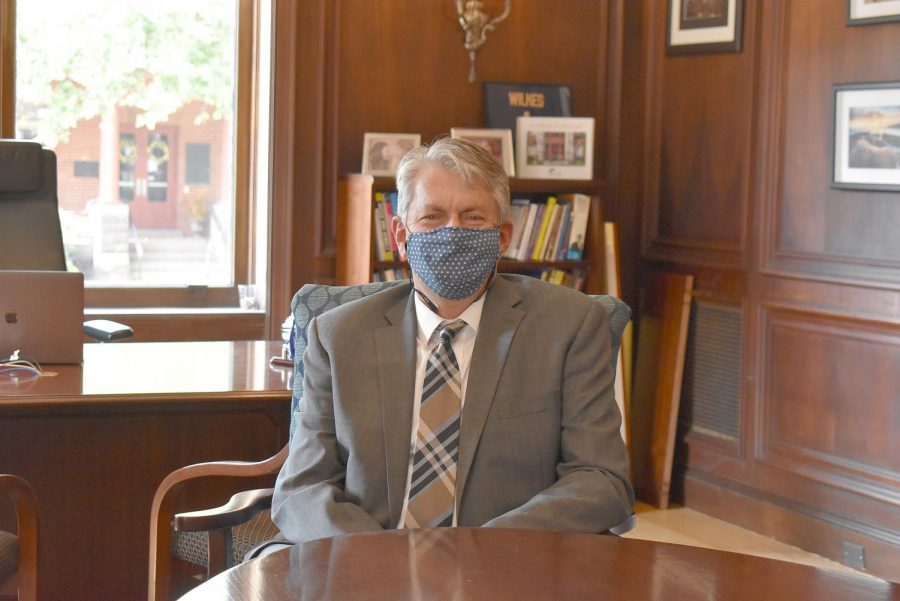 Dr. Greg Cant prepares to welcome the Wilkes community back to campus in his mask.