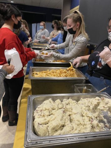 Students indulged in a buffet line of food courtesy of on-campus dining service. The buffet included mashed potatoes, french fries, tater tots, potato
pancakes and mini pierogies.