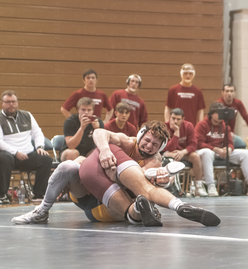 Nuss working to gain dominant positioning over his opponent during the John Reese Duals on Jan. 29.